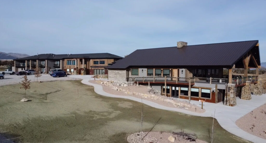 Scenic view of both Elk Ridge Lodge and the Event Center at Royal Creek Ranches, showcasing the expansive space ideal for organizations looking for top corporate retreat venues near salt lake city.